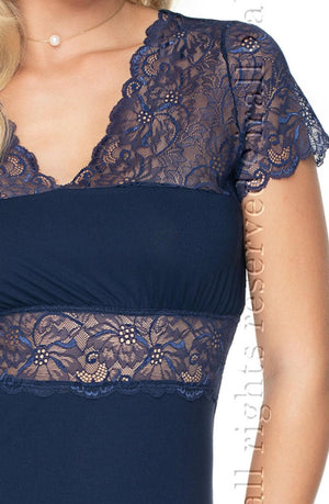 A close-up of a person wearing the Irall Cameron Nightdress Navy Blue (available in sizes 2XL-5XL), which features delicate floral lace detailing on the short sleeves, neckline, and midriff. The intricate lace complements a delicate choker necklace. The background is plain white.