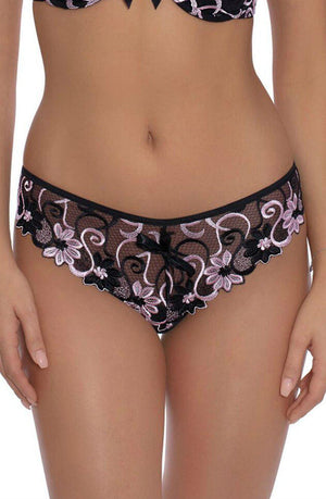 A woman models Roza Florence Pink Brief lingerie, featuring lacy black and pink underwear with intricate floral patterns and scalloped edges. She also wears a matching bra, partially visible at the top of the image, against a plain white background.