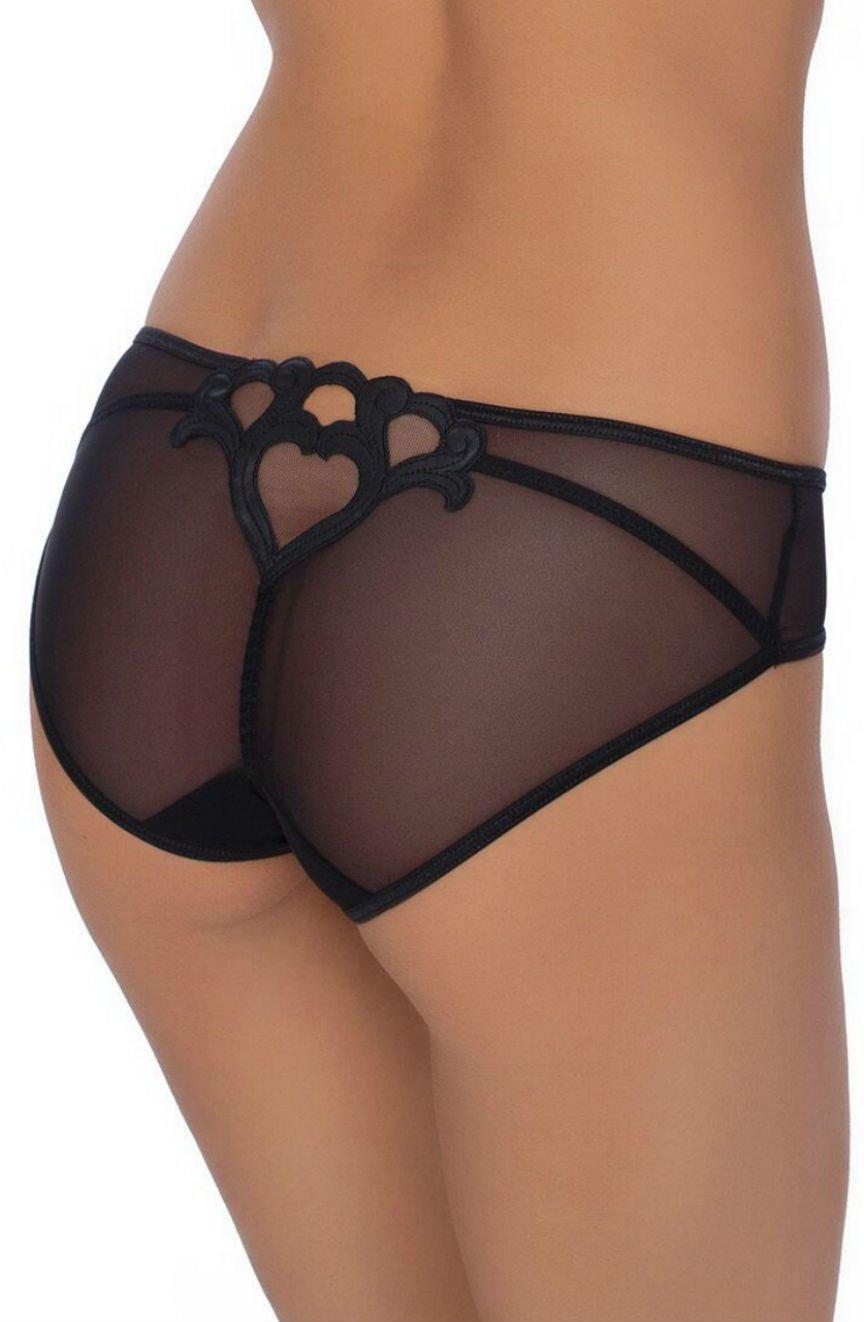 A person is wearing elegant lingerie, specifically the Roza Lica Briefs in black. These sheer lace underwear feature intricate heart-shaped embroidery on the back. The image focuses on the lower back and upper thigh area, showcasing the detailed craftsmanship of the Roza Lica Briefs by Roza.