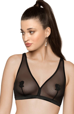 A woman with long dark hair in a high ponytail is wearing the Roza Lisbet Black Soft Cup Bra from the Roza brand, featuring sheer black fabric with rose embroidery on the cups. She has a medium complexion, light makeup, and is looking to her left. She is also wearing a single dangling earring.