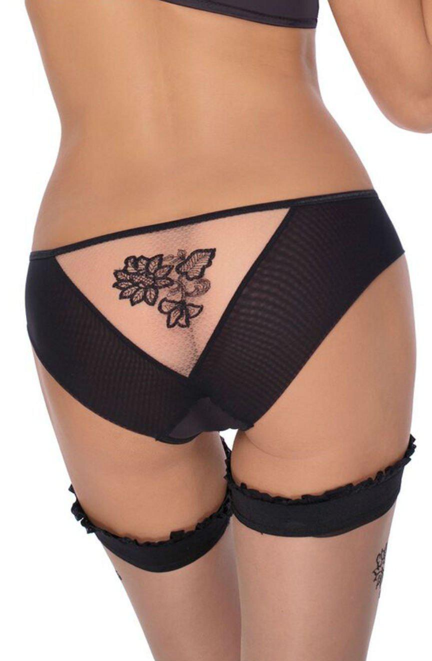 A person is seen wearing the Roza Mehendi Brief Black, which features a delicate floral design on the back. They also sport black garter belts with ruffles adorning both thighs, revealing the upper and lower back along with a glimpse of the waist in an elegant manner reminiscent of Mehendi design intricacies.