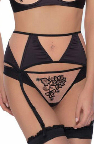 A person wearing the elegant Roza Mehendi Suspender Belt in black, featuring intricate Mehendi design embroidery and mesh panels. The set includes a bra, high-waisted garter belt, and panties, all paired with black stockings attached to the garter straps. The overall design by Roza is both sophisticated and detailed.