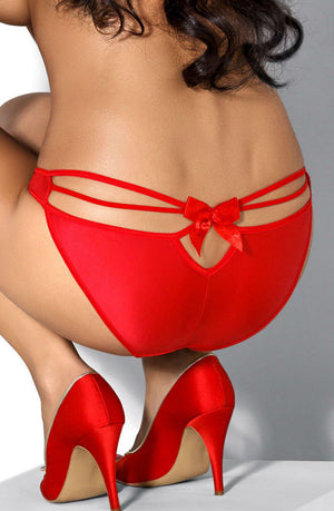 A person is kneeling with their back to the camera, showcasing the Roza Mimi Brief Red lingerie, which features a keyhole cutout with a bow and an open elasticated strap. They are also wearing red stiletto high heels. The background is a plain gray.