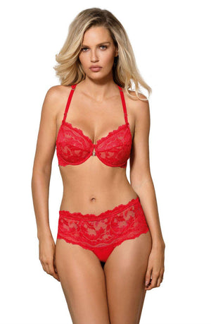 A person with long blonde hair is wearing a red lace lingerie set, featuring the Roza Sefia Soft Cup Bra Red by Roza, with a delicate lace underband and matching high-waisted panties. They are standing against a plain white background.