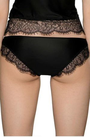 A person is standing with their back to the camera, showcasing luxury lingerie. They're wearing the Roza Sija Black Brief with delicate eyelash lace detailing that matches the top section of their outfit. The image mainly focuses on the lower back and underwear, highlighting the exquisite design from Roza.