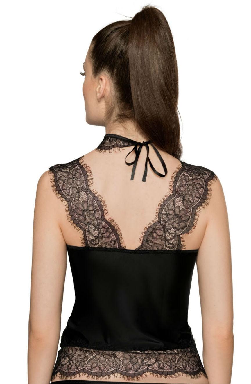 A woman with long brown hair tied in a high ponytail is seen from the back. She is wearing the Roza Sija Black Shirt, designed by Roza. This elegant satin and lace halter top features intricate floral patterns and luxurious eyelash lace details on the shoulders and back, culminating in a sheer lace hem. The top ties at the neck with a black ribbon, making it an ideal gift.