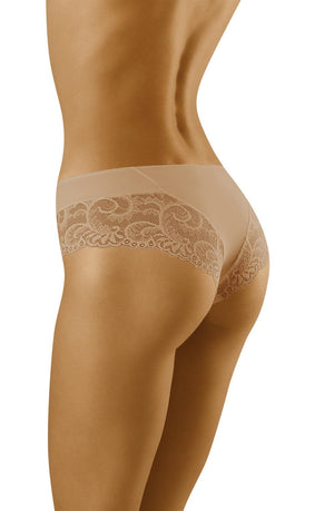 A person is shown from the back, modeling beige-colored Wolbar Cara Briefs by the brand Wolbar. The lingerie showcases exquisite luxury lace detailing on the sides and back. The person's left arm is raised, partially visible in the image. The plain white background accentuates the timeless elegance of the scene.