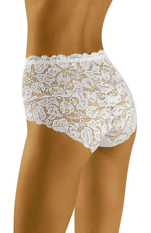 A close-up view of a person wearing the Wolbar Teri White Brief by Wolbar, featuring an intricate floral lace pattern across the lacy material. The image focuses on the lower body, showcasing the design, texture, and stretchy waistband of these briefs. A comfortable cotton gusset ensures added comfort against a plain white background.